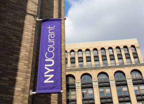 Purple flag with NYU COURANT written in white text