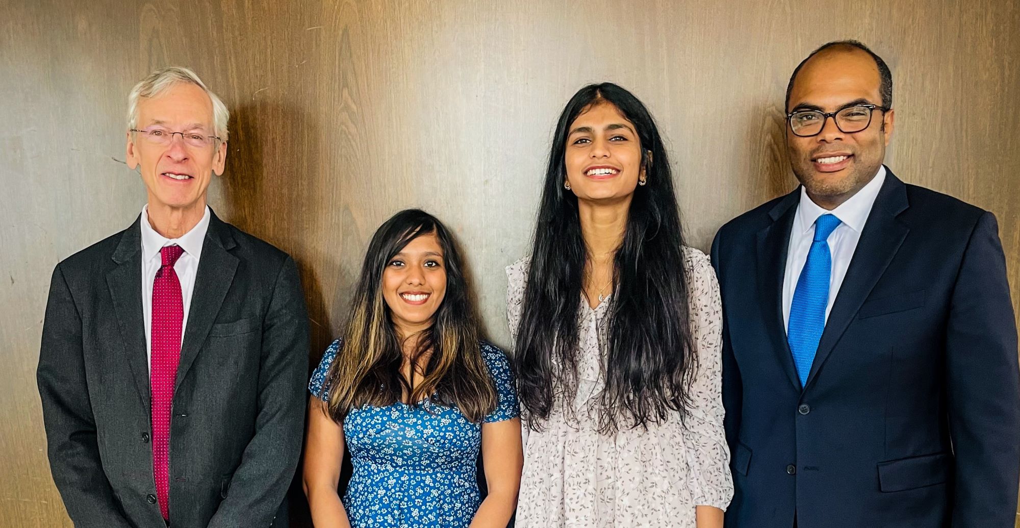 Deepti Saravanan and Jahnavi Swetha Pothineni (Center Left and Center Right) pose with Courant Director Russel Caflisch (Left) and Professor Anasse Bari (Right) at the Prizes & Fellowship Ceremony.