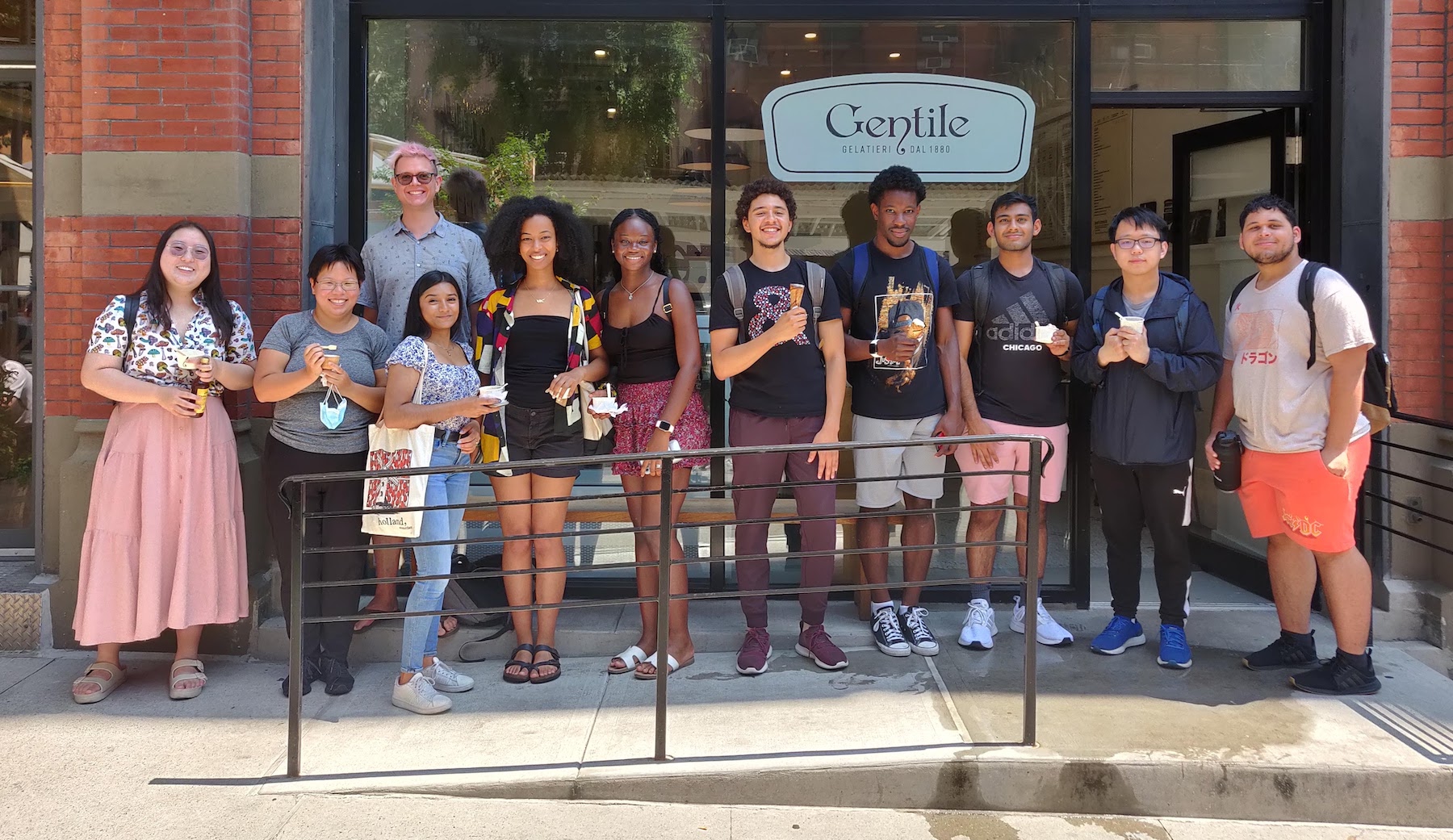 The Pathway to AI students pose outside a gelato shop on University Place.